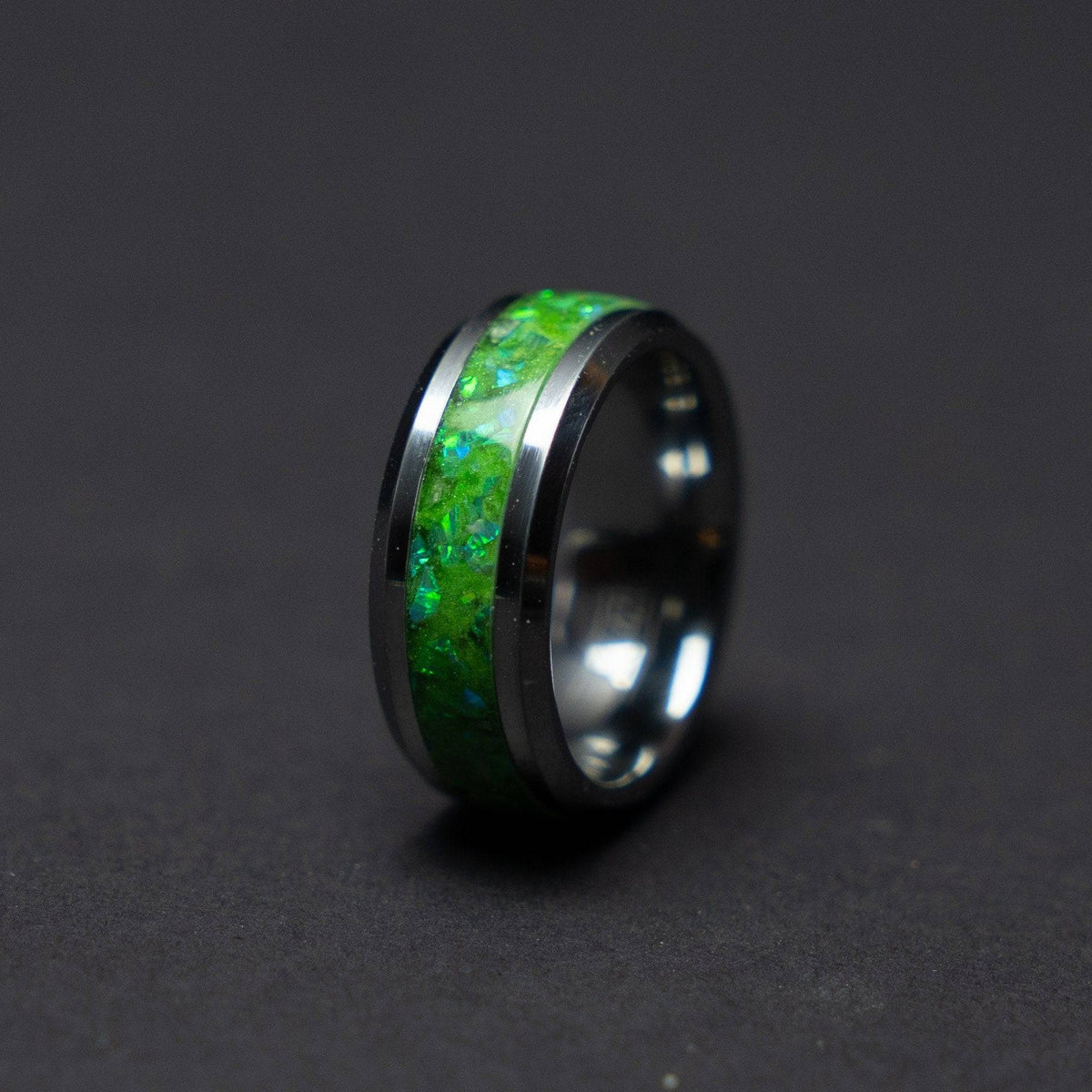Glow in the dark tungsten ring filled with green opal