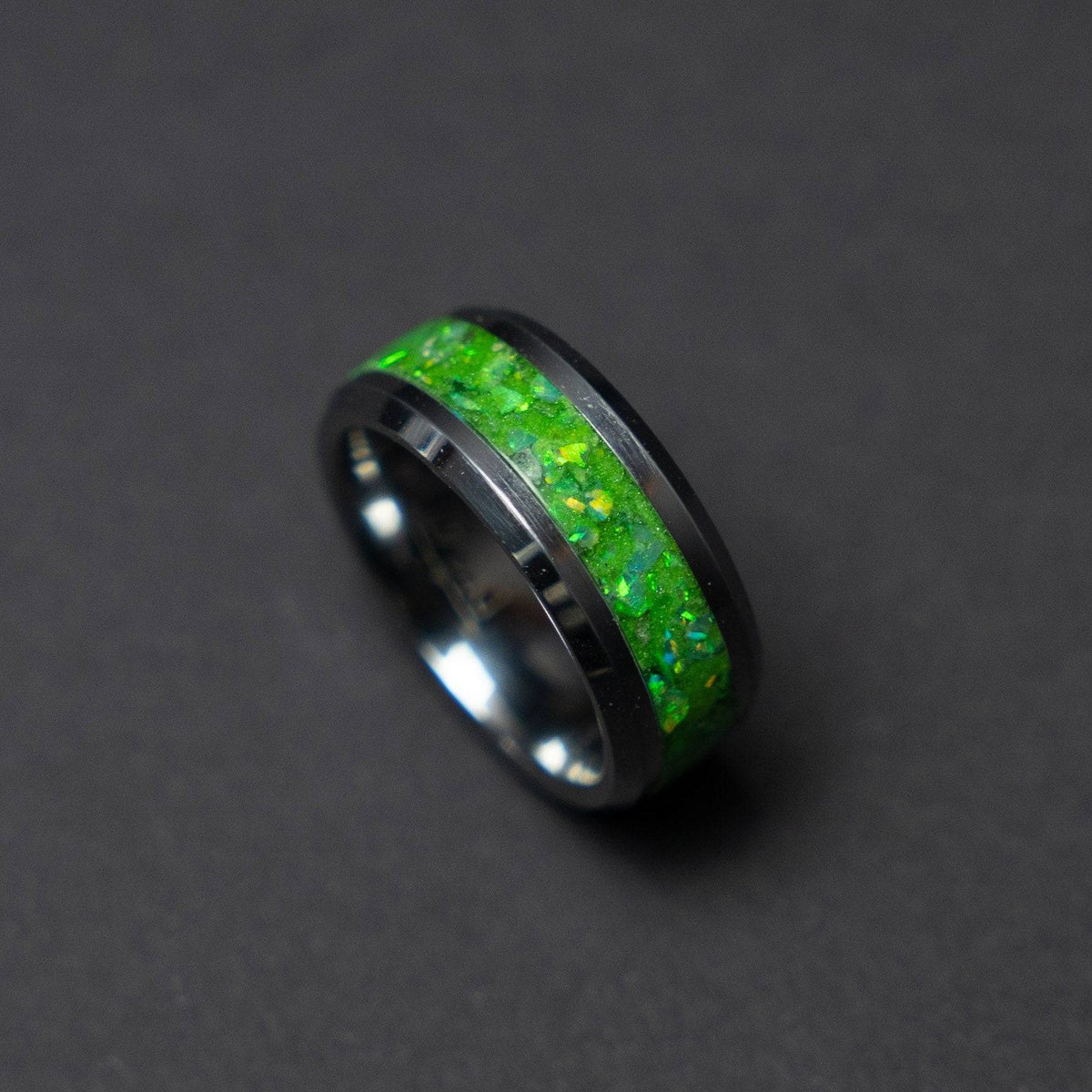 Glow in the dark tungsten ring filled with green opal