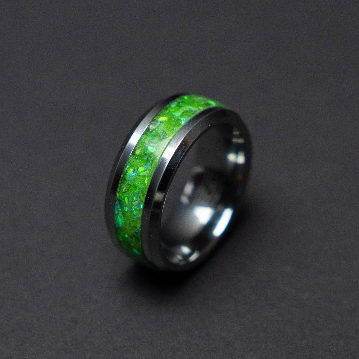 Glow in the dark tungsten ring filled with green opal