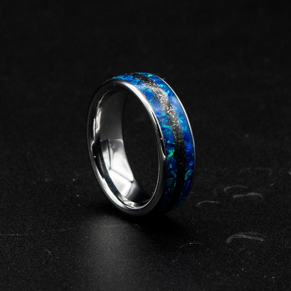 Blue opal ring with meteorite inlay.