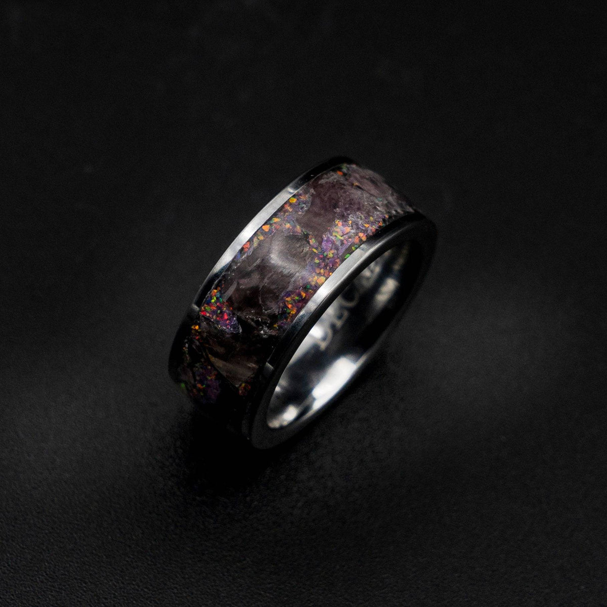 Tungsten ring filled with super seven gemstone