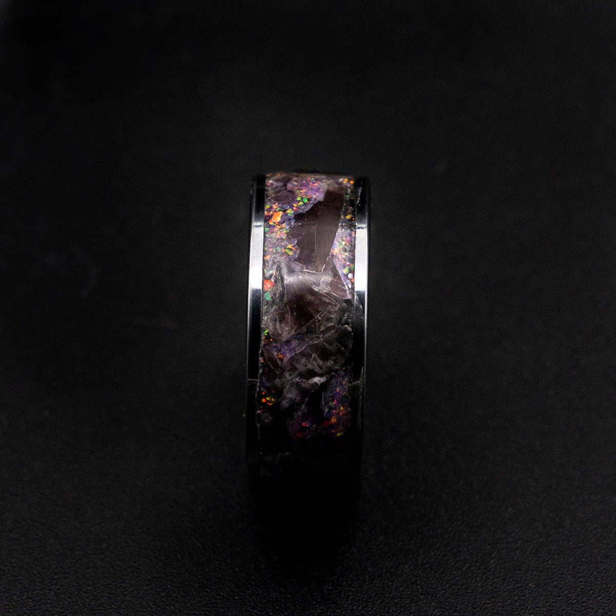 Tungsten ring filled with super seven gemstone