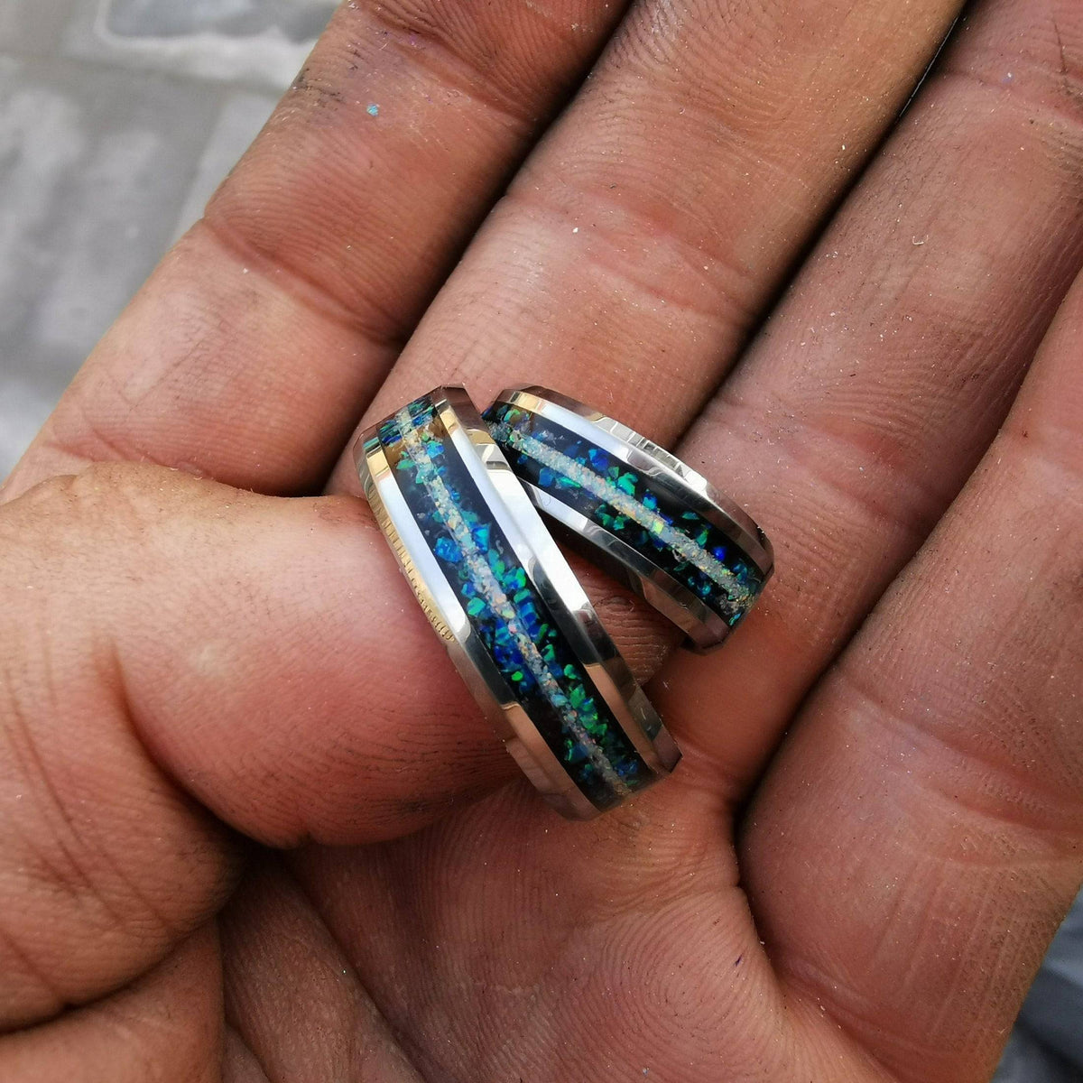 Beveled tungsten ring with galaxy opal and a white opal line