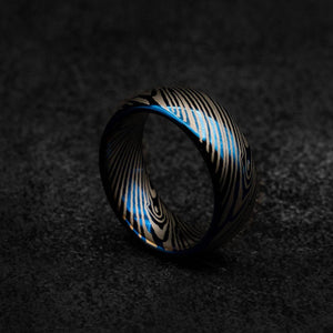 Blue tungsten ring with Damascus pattern