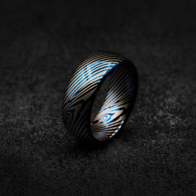 Blue tungsten ring with Damascus pattern