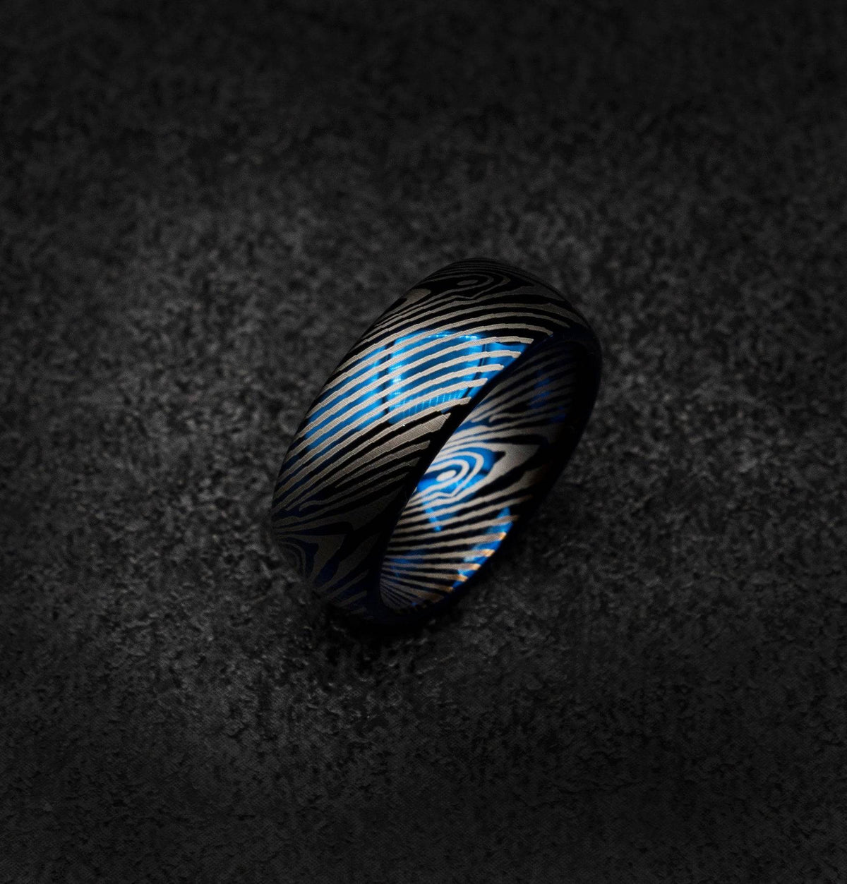 Blue tungsten ring with Damascus pattern