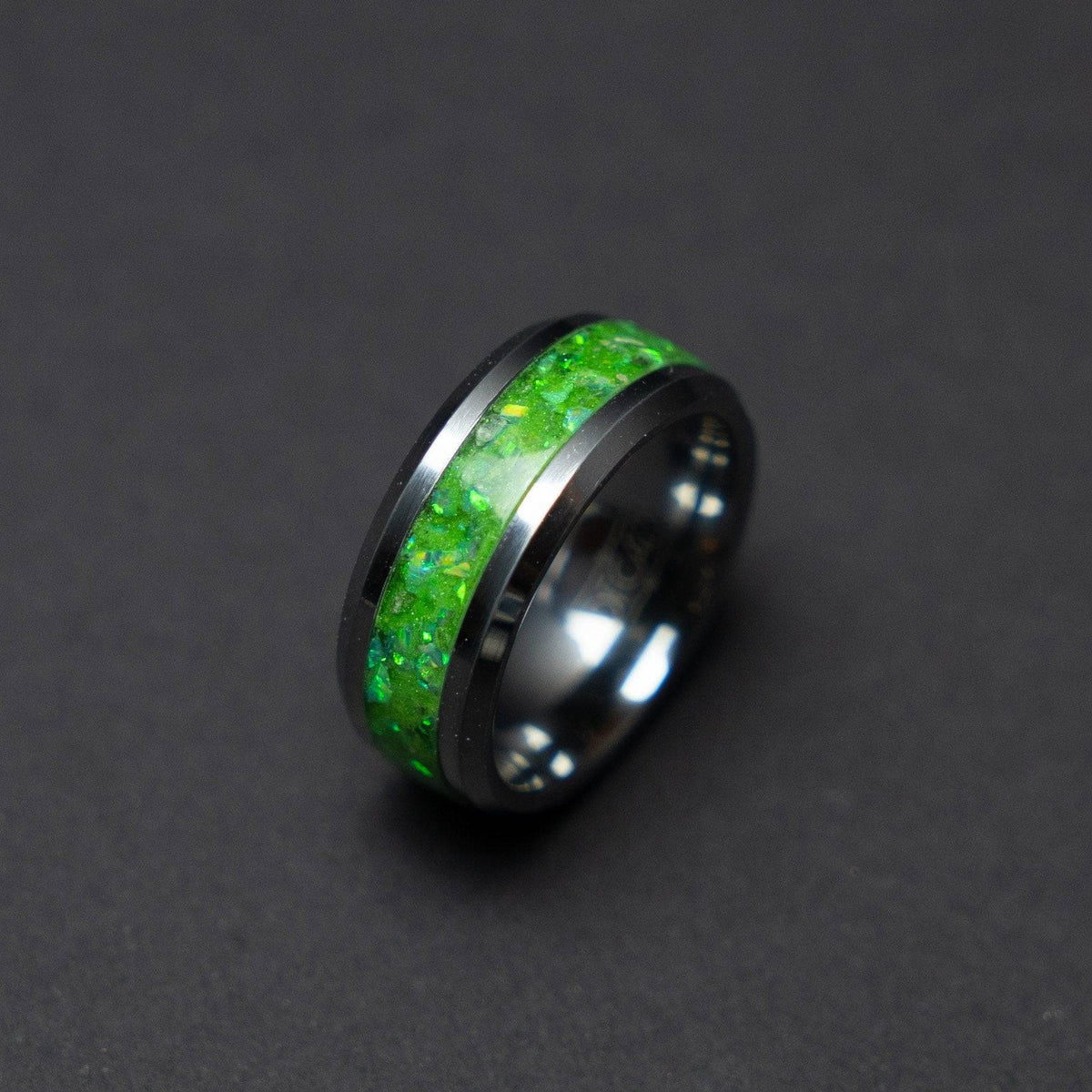 Glow in the dark tungsten ring filled with green opal