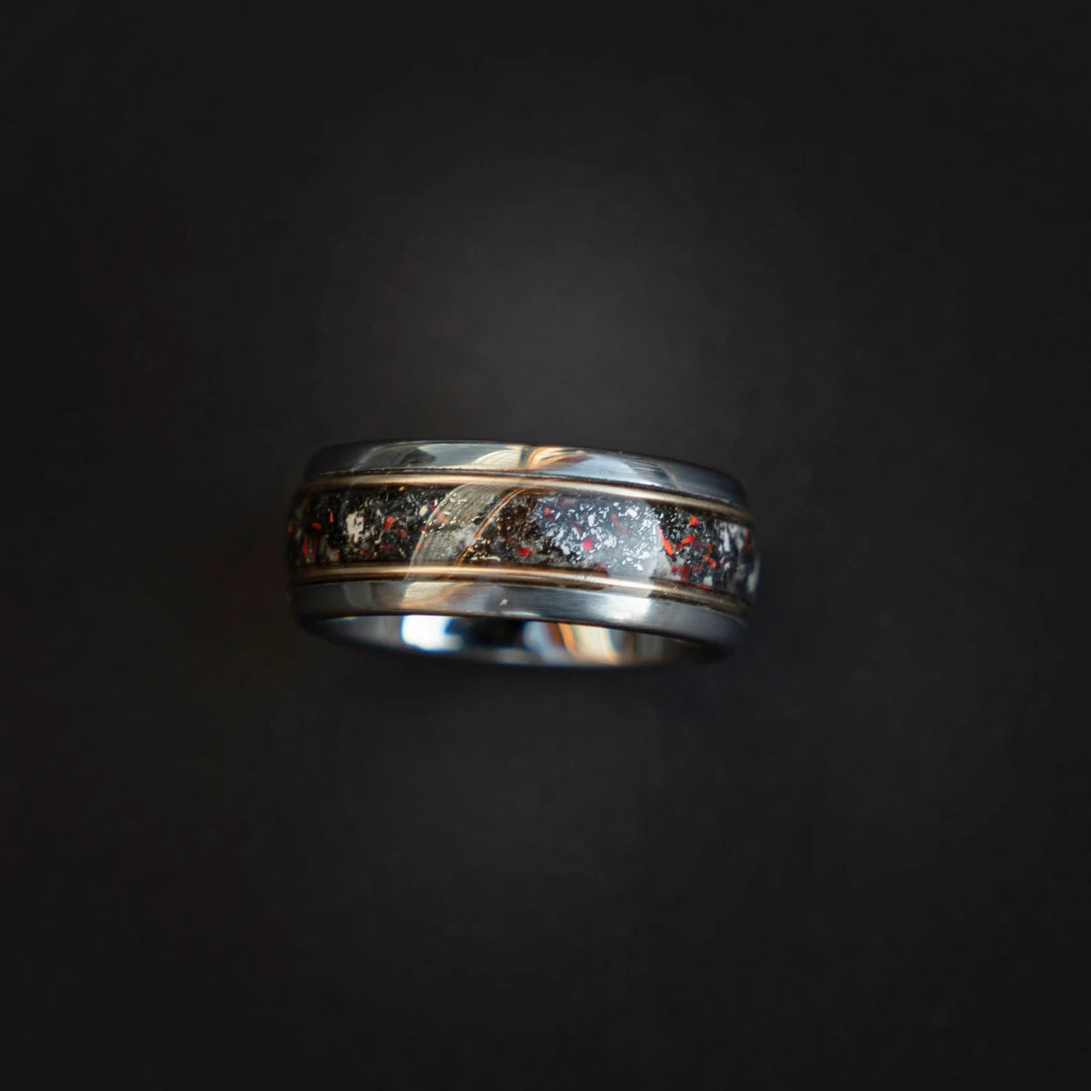 Tungsten ring filled with meteorite dust, red opal and 18k gold