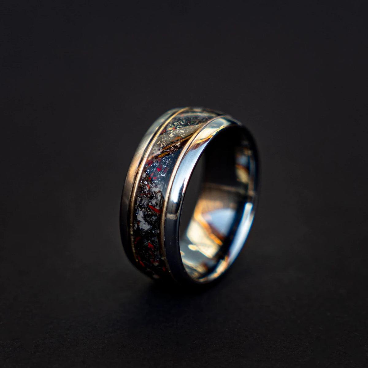 Tungsten ring filled with meteorite dust, red opal and 18k gold