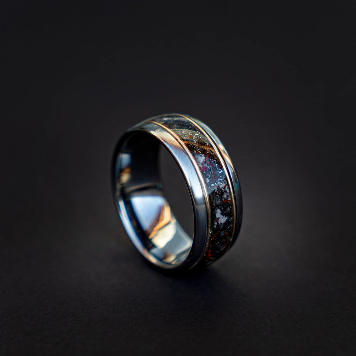 Tungsten ring filled with meteorite dust, red opal and 18k gold