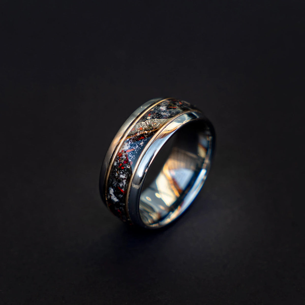 Tungsten ring filled with meteorite dust, red opal and 18k gold