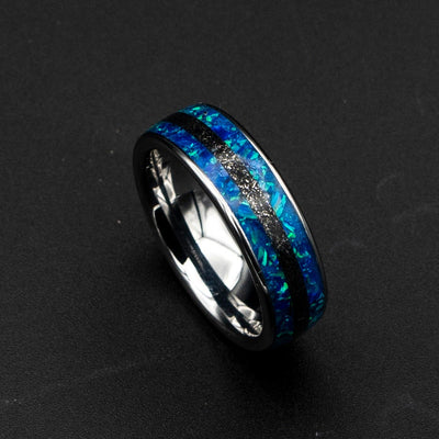 Blue opal ring with meteorite inlay.