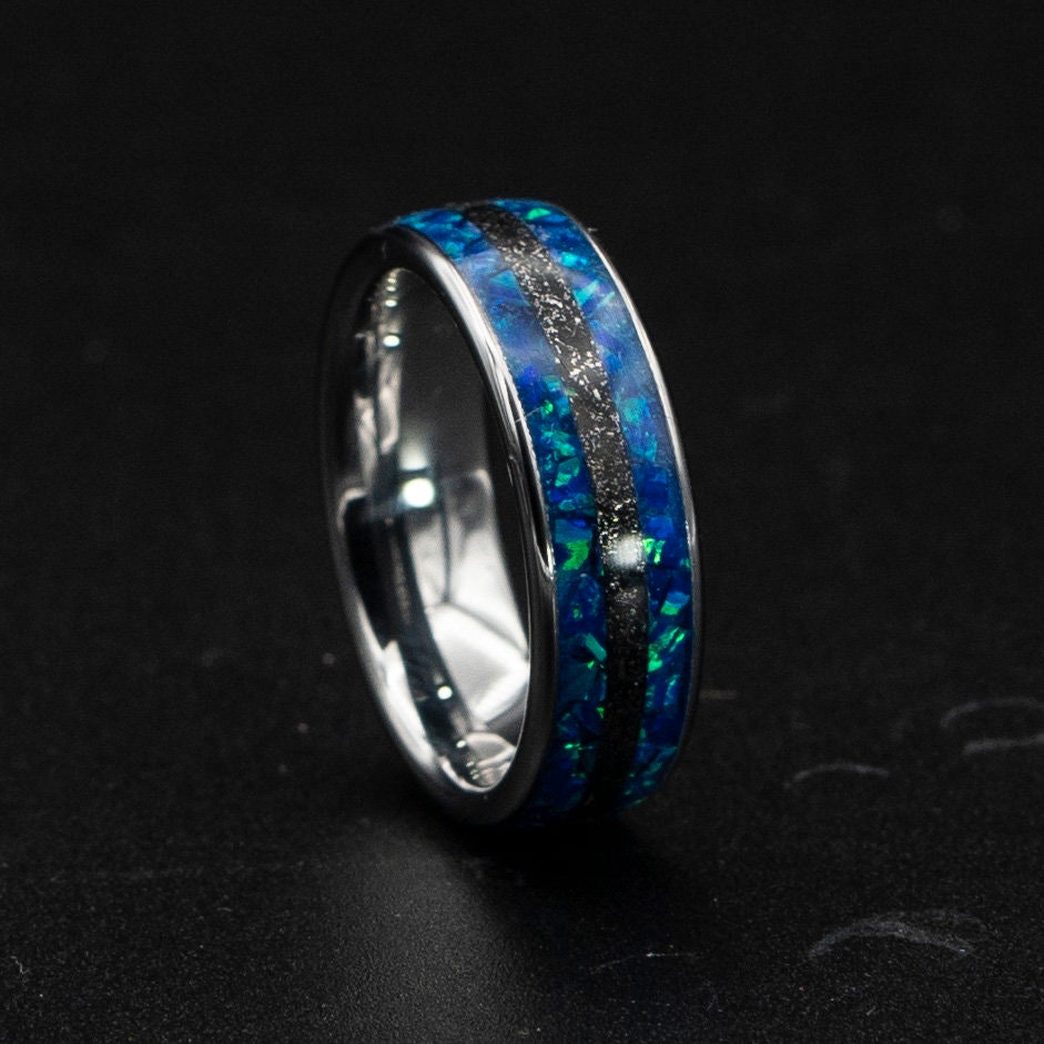 Blue opal ring with meteorite inlay.