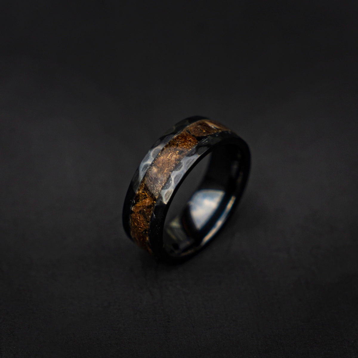 Velociraptor fragments in a black ceramic faceted hammered band,  engagement ring, mens ring, handmade wedding band, mens wedding band - Decazi