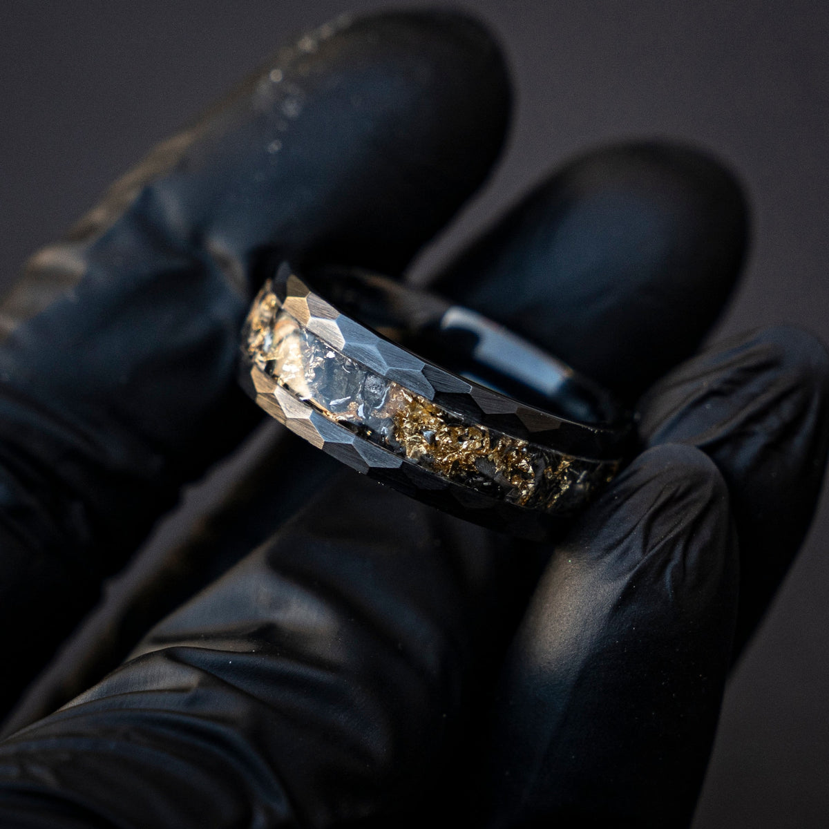 Black faceted ceramic ring filled with Goldleaf and Meteorite