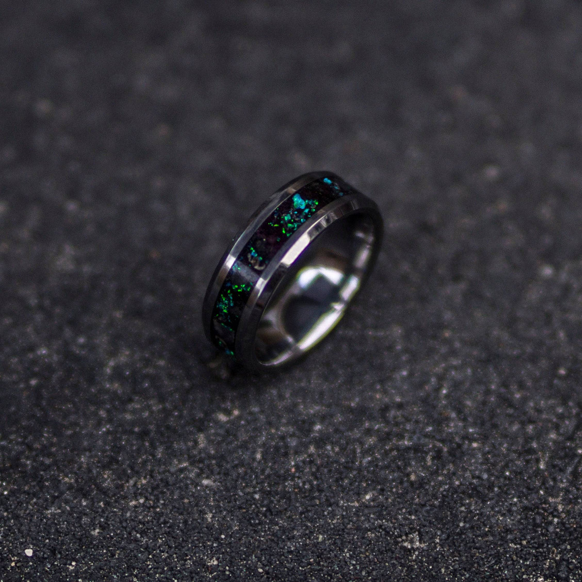 Tungsten ring filled with galaxy opal and glow stones