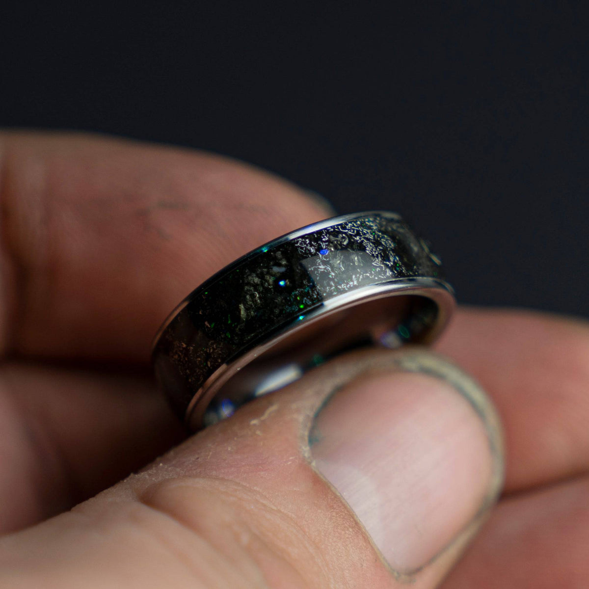 Tungsten ring filled with genuine Moldavite