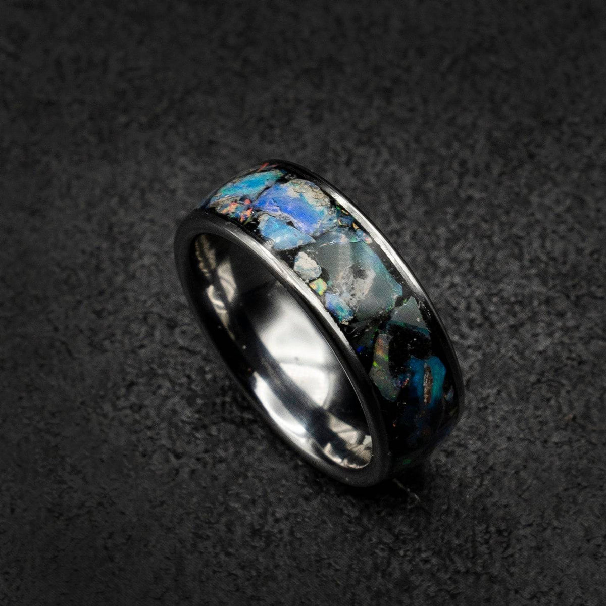 Tungsten ring filled with genuinge Australian black opal