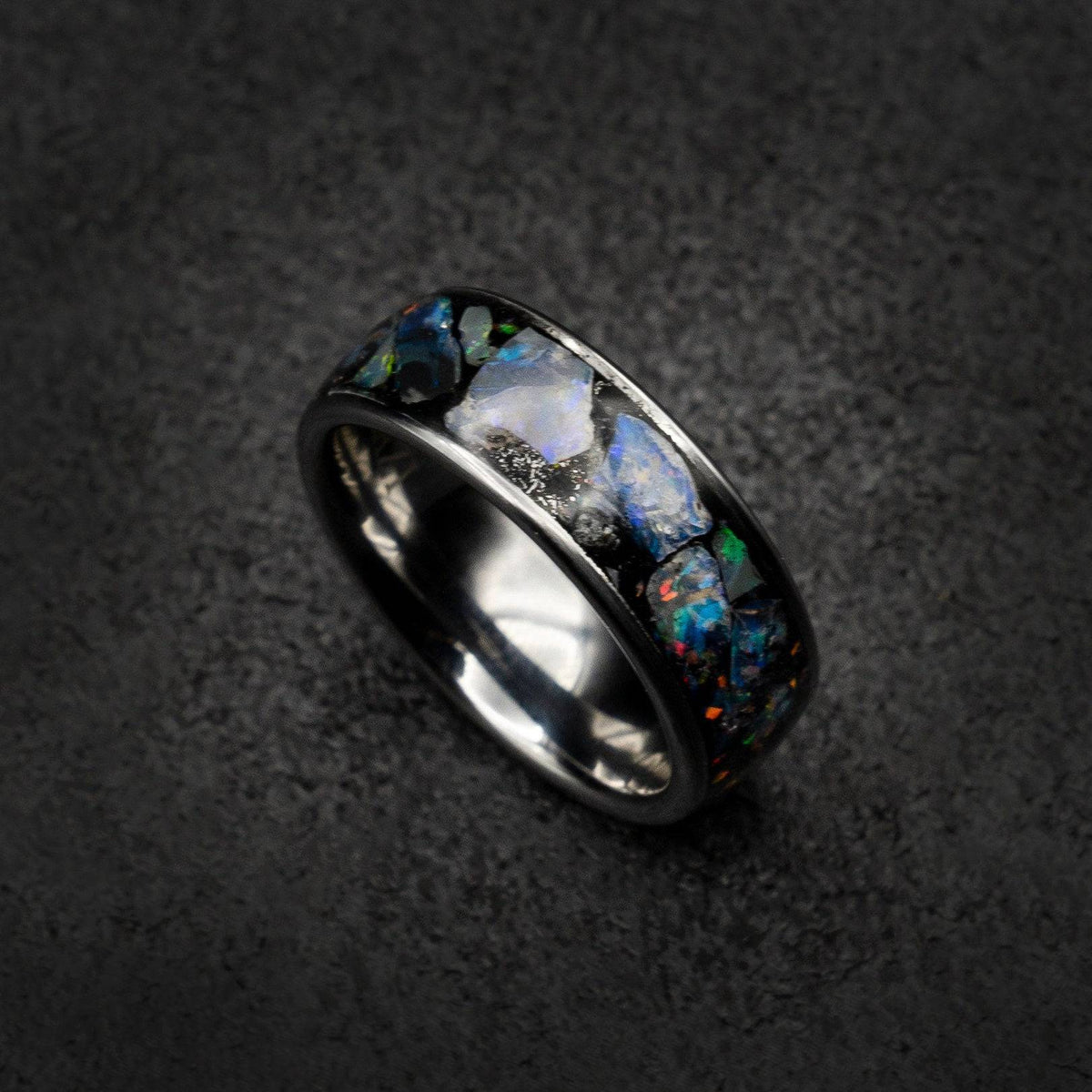Tungsten ring filled with genuinge Australian black opal