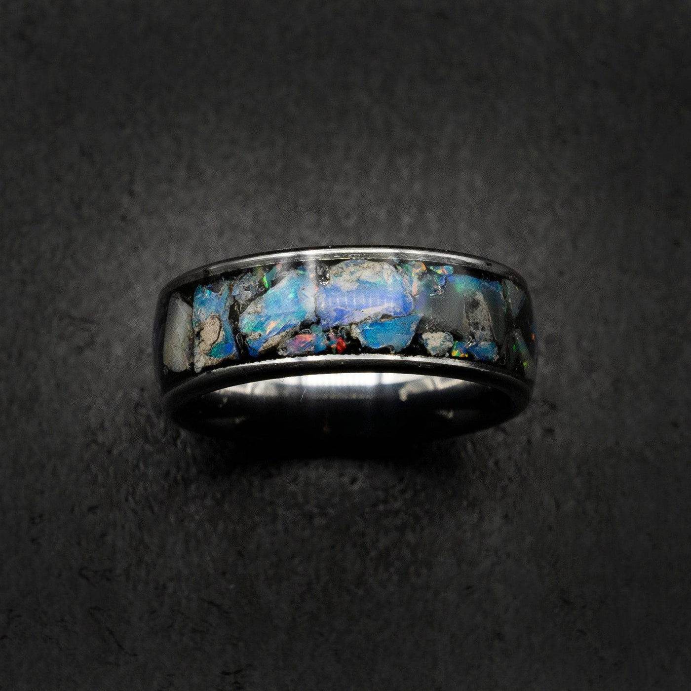 Tungsten ring filled with genuinge Australian black opal