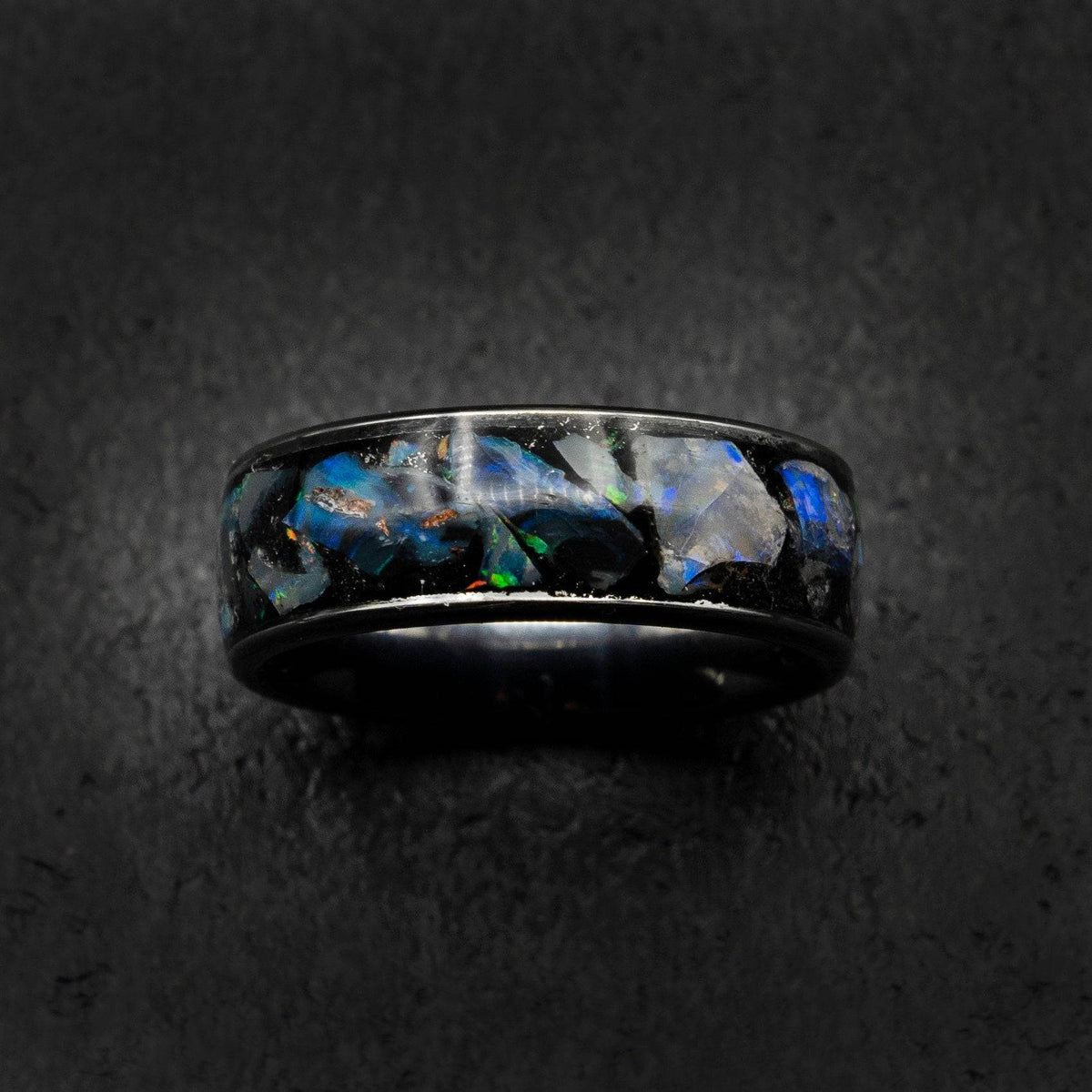 Tungsten ring filled with genuinge Australian black opal