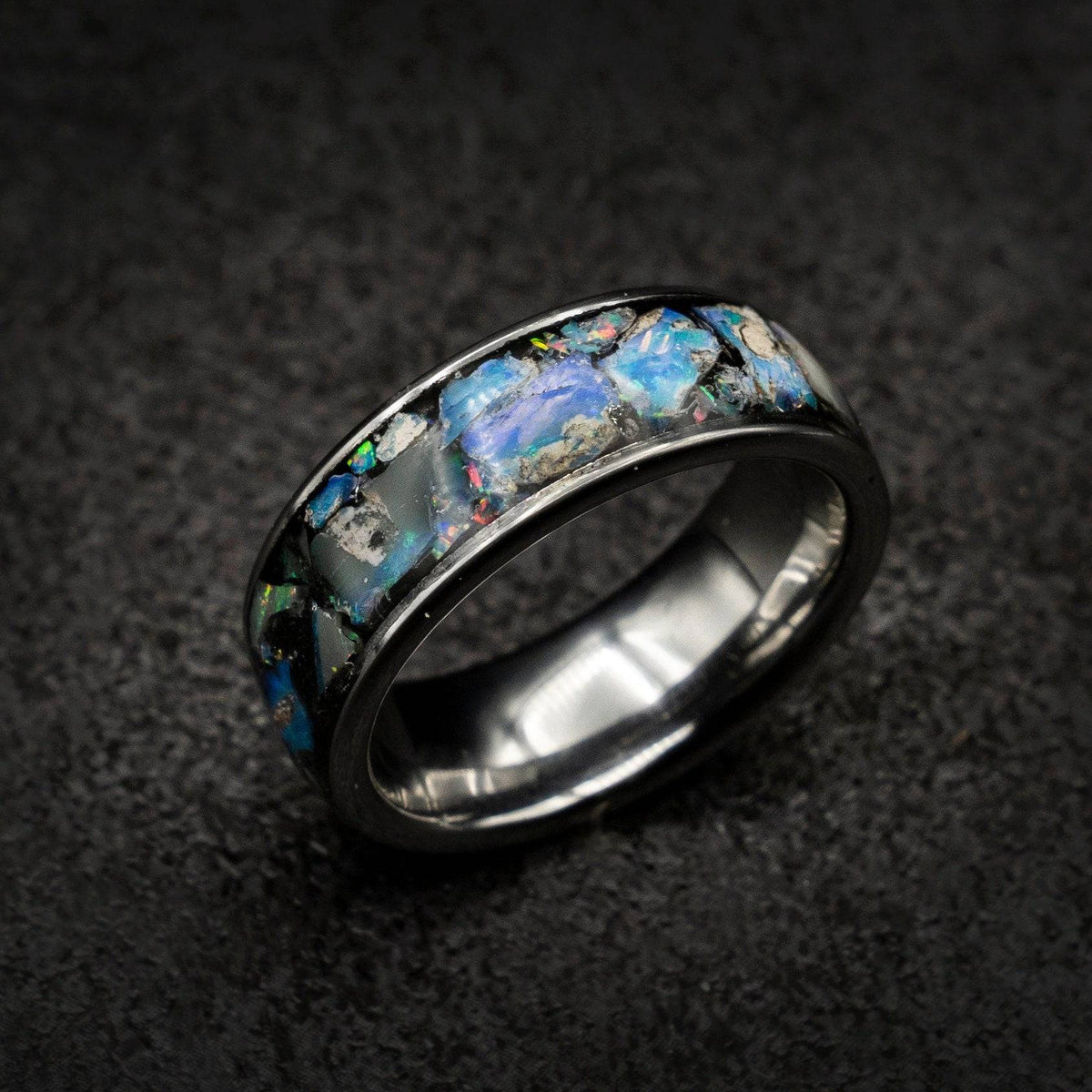 Tungsten ring filled with genuinge Australian black opal