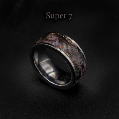 Tungsten ring filled with super seven gemstone
