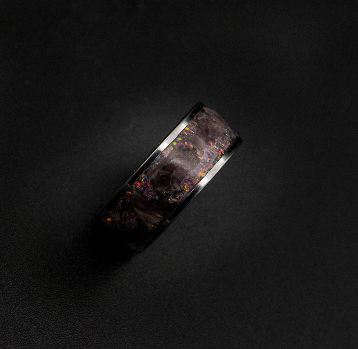 Tungsten ring filled with super seven gemstone