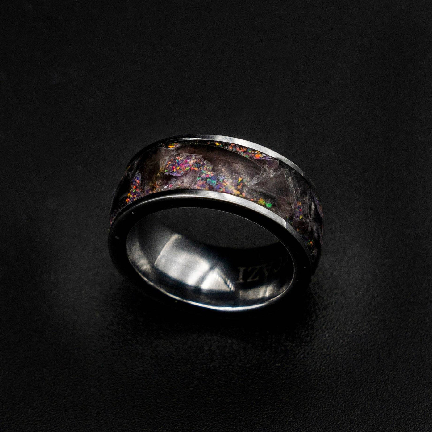 Tungsten ring filled with super seven gemstone