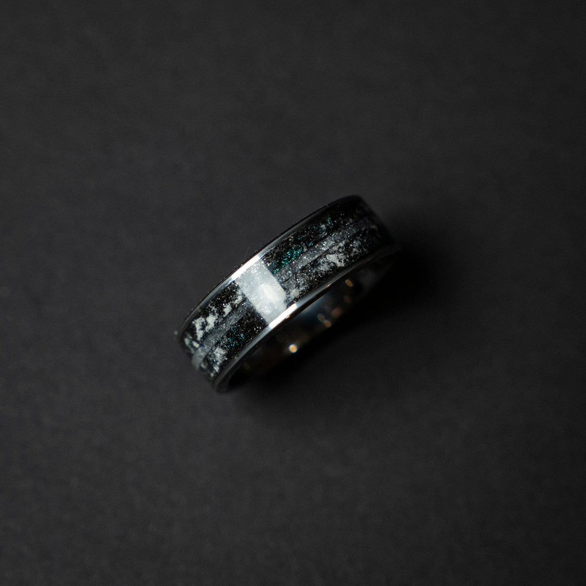 Tungsten ring with a line of Herkimer diamond, meteorite and glow