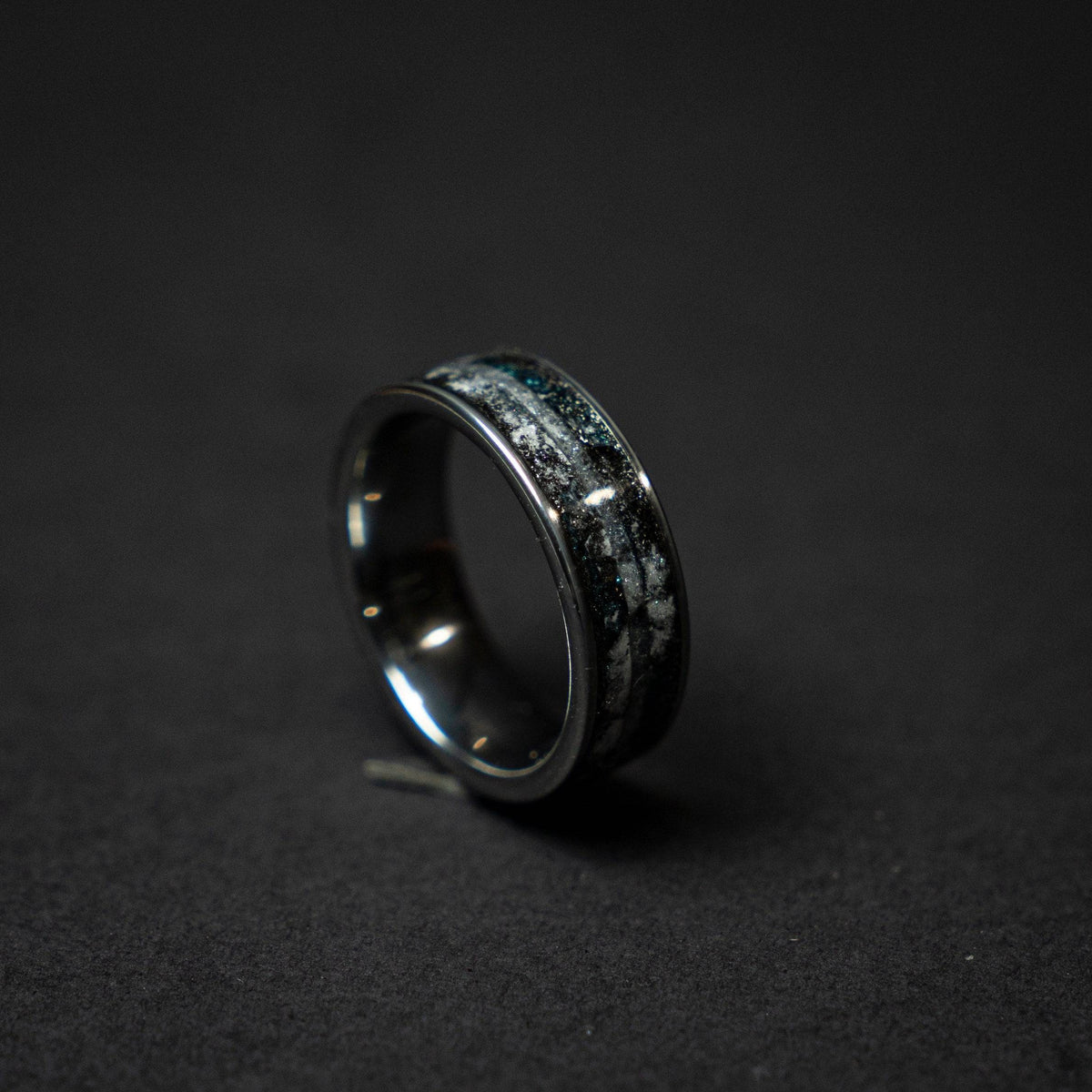 Tungsten ring with a line of Herkimer diamond, meteorite and glow