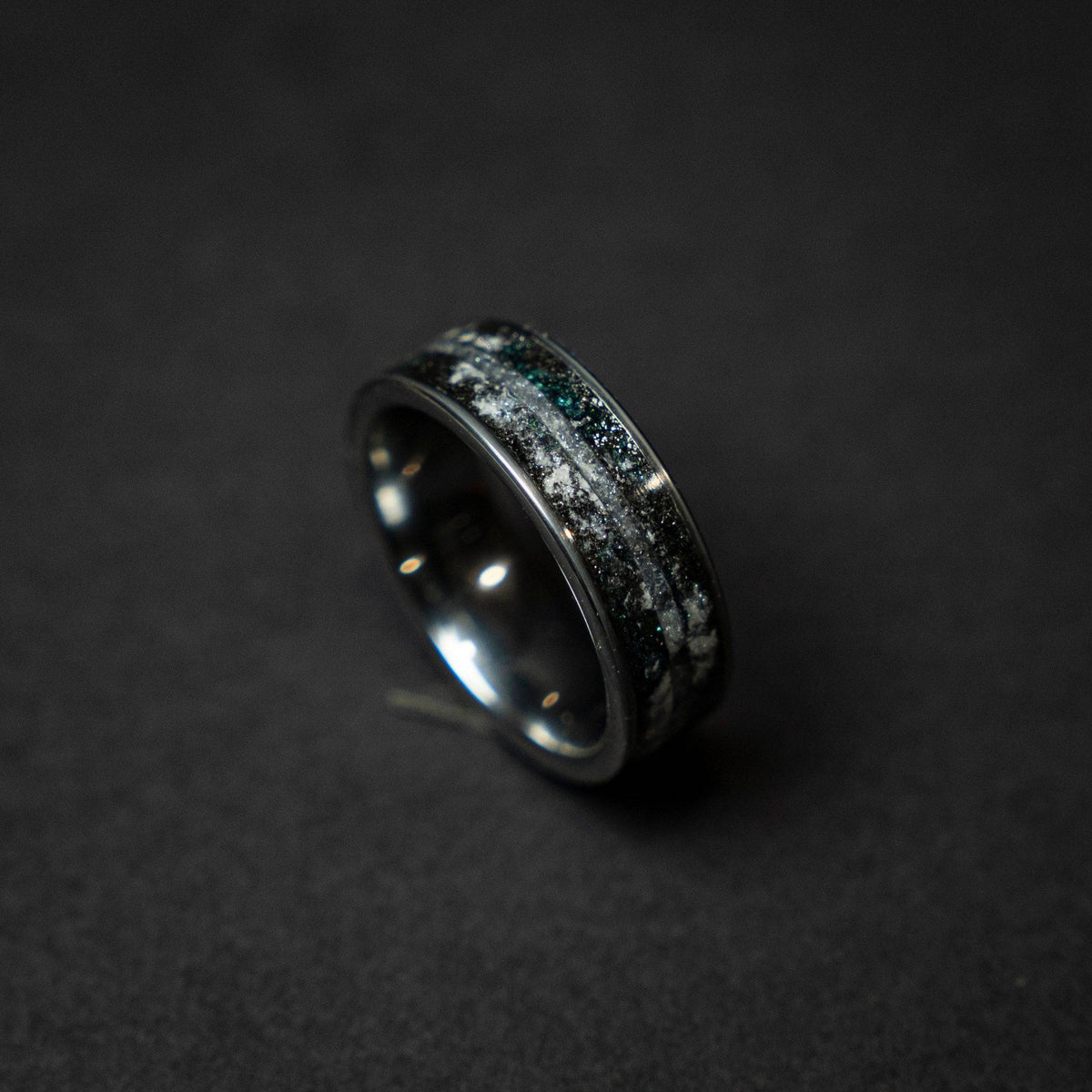 Tungsten ring with a line of Herkimer diamond, meteorite and glow